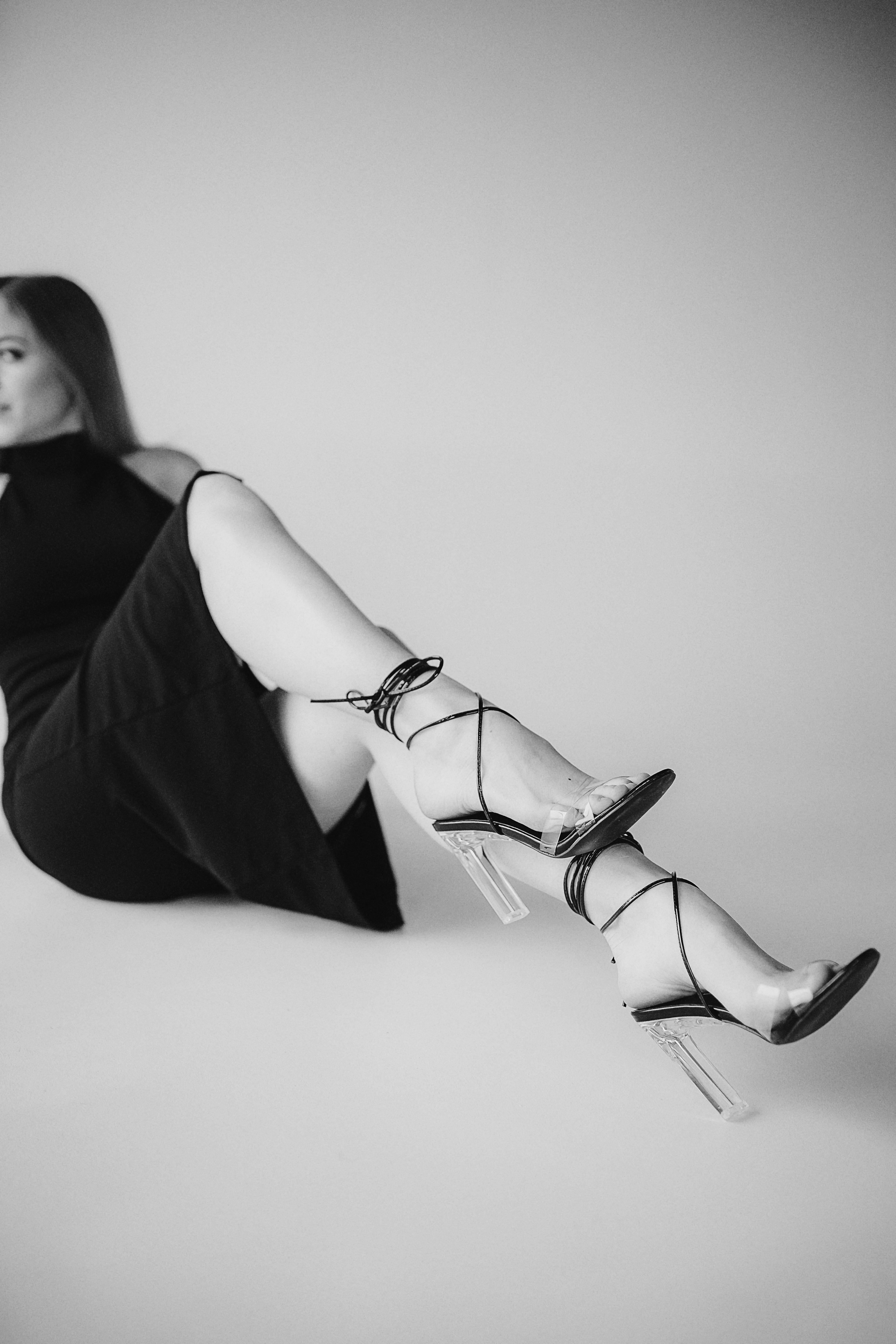 Woman in High Heels Laying on Ground · Free Stock Photo