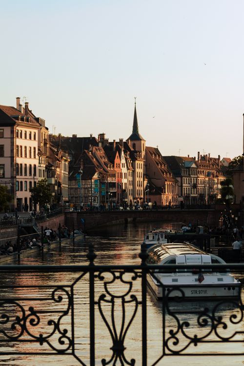 Free Beautiful view of Strasbourg at sunset, showcasing the historic architecture along the canal. Stock Photo