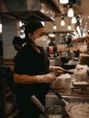 A Woman Cooking Food in a Restaurant