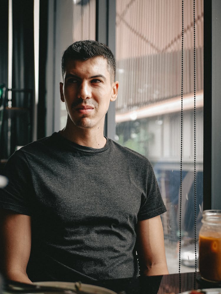 Close-Up Shot Of A Man Wearing Gray Shirt