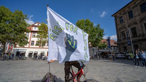 Person with Banner in Town