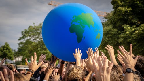 Crowd Hands Raised around Globe