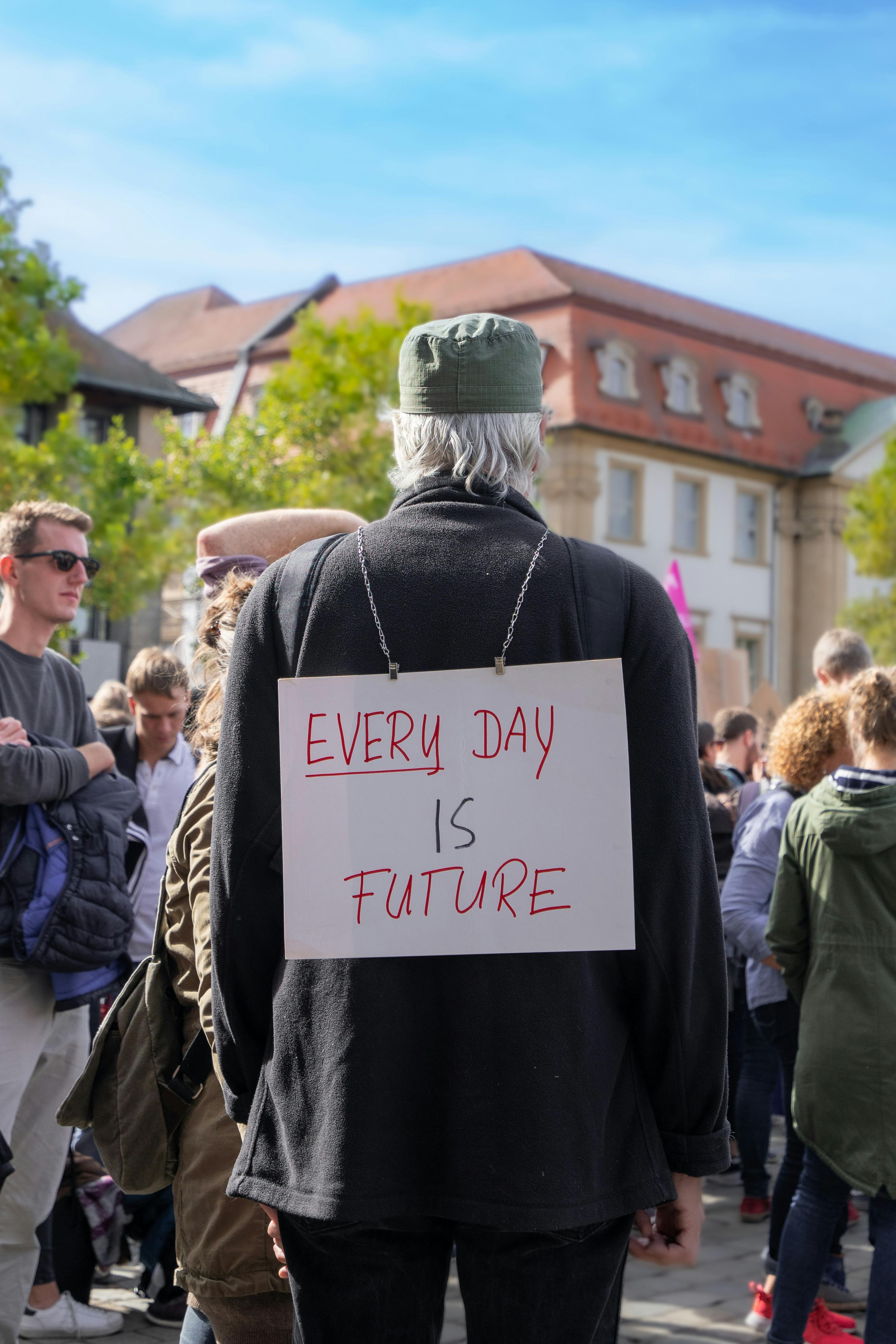 elderly man with placard during rally