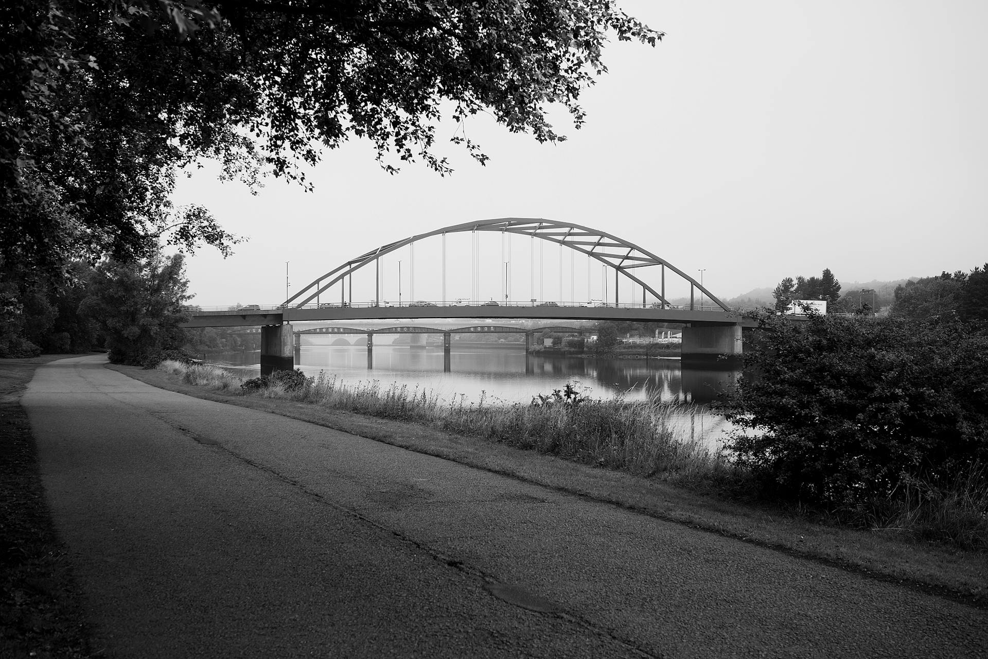 Monochrome view of Scotswood Bridge crossing River Tyne, Newcastle upon Tyne.