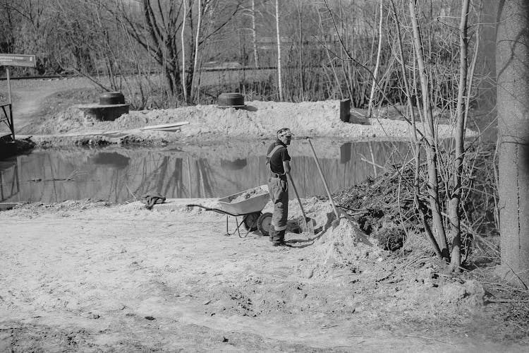 Photo Of Construction Worker Standing With Shovel