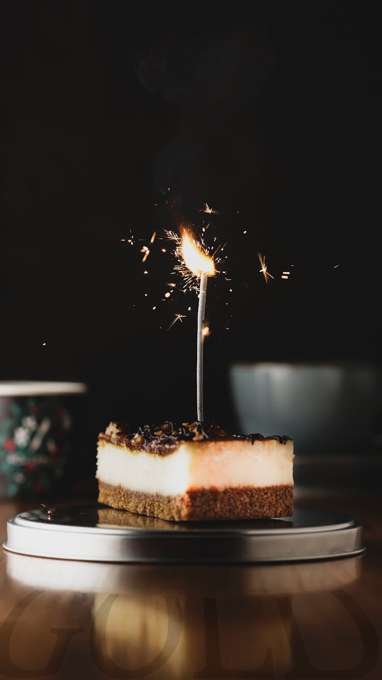 Sparkler On A Slice Of Birthday Cake