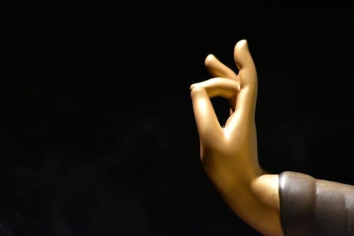 Figure Hand against Black Background