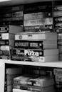 A Grayscale of Books on a Bookshelf