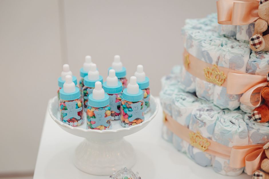 baby diapers and feeding bottles on table