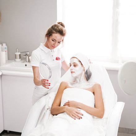 Beautician talking a client through her treatment results