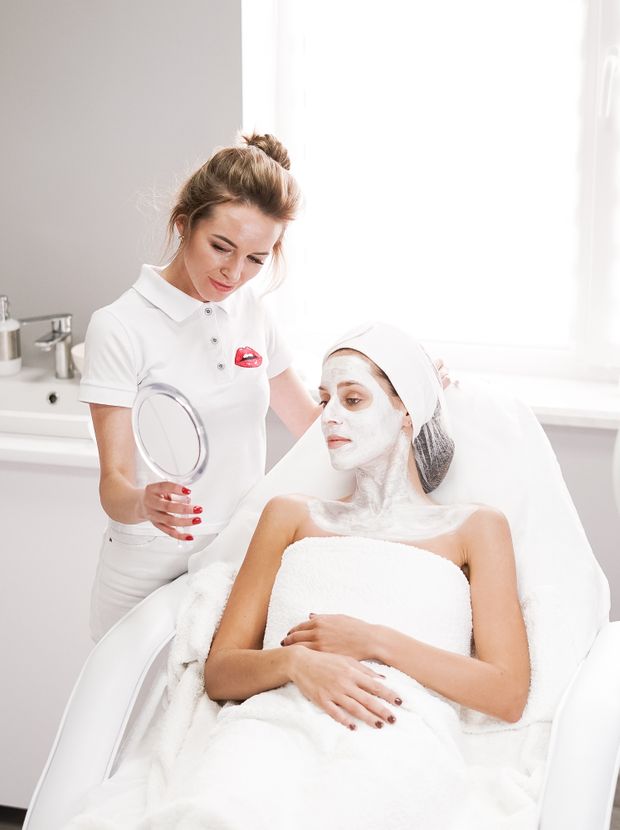 Beautician talking a client through her treatment results
