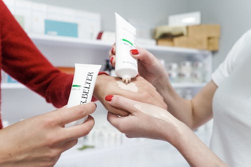 Women Using Hand Cream