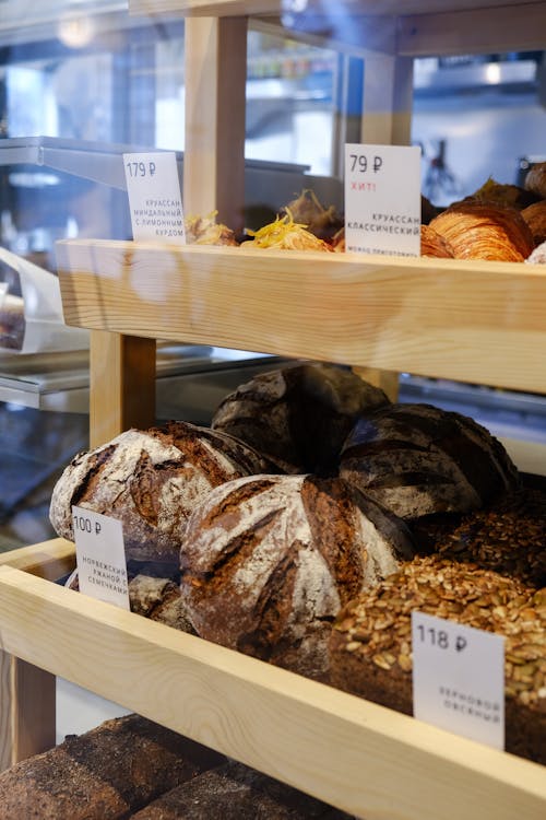 Free Variety of Bread on White Wooden Shelf Stock Photo