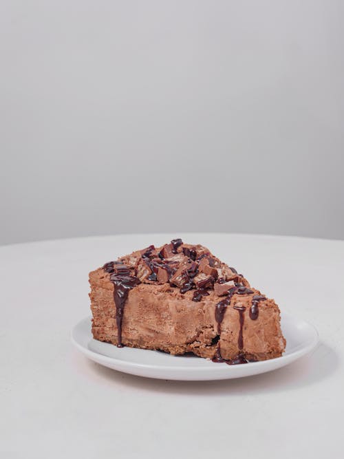 Free Slice of Chocolate Mousse Cake on White Saucer Stock Photo