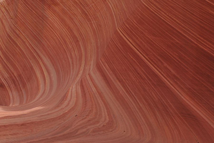 Aerial view of banded sandstone in an arid basin — photo by ARNAUD VIGNE on Pexels