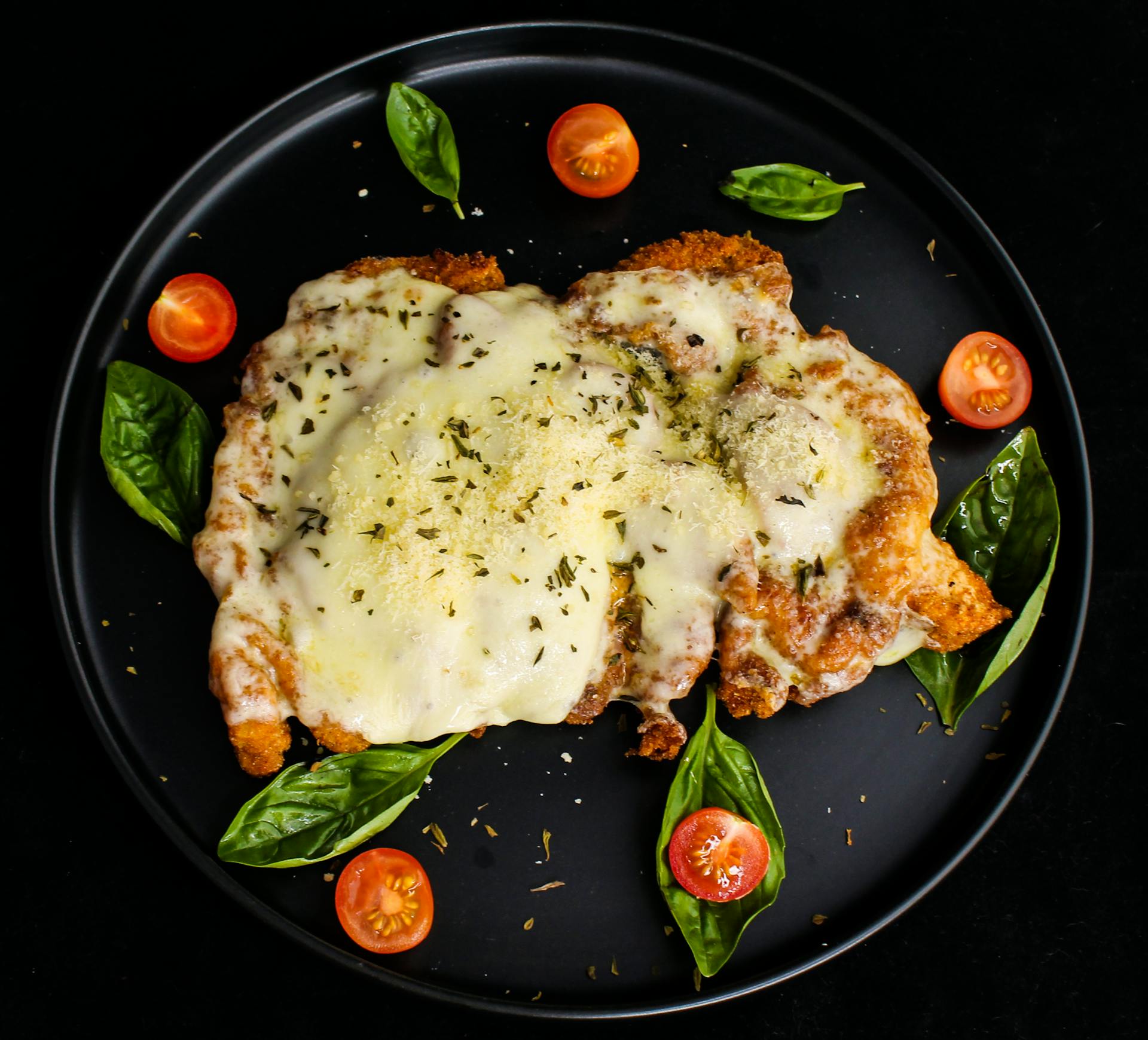 Cooked Chicken with Creamy Topping on a Ceramic Plate