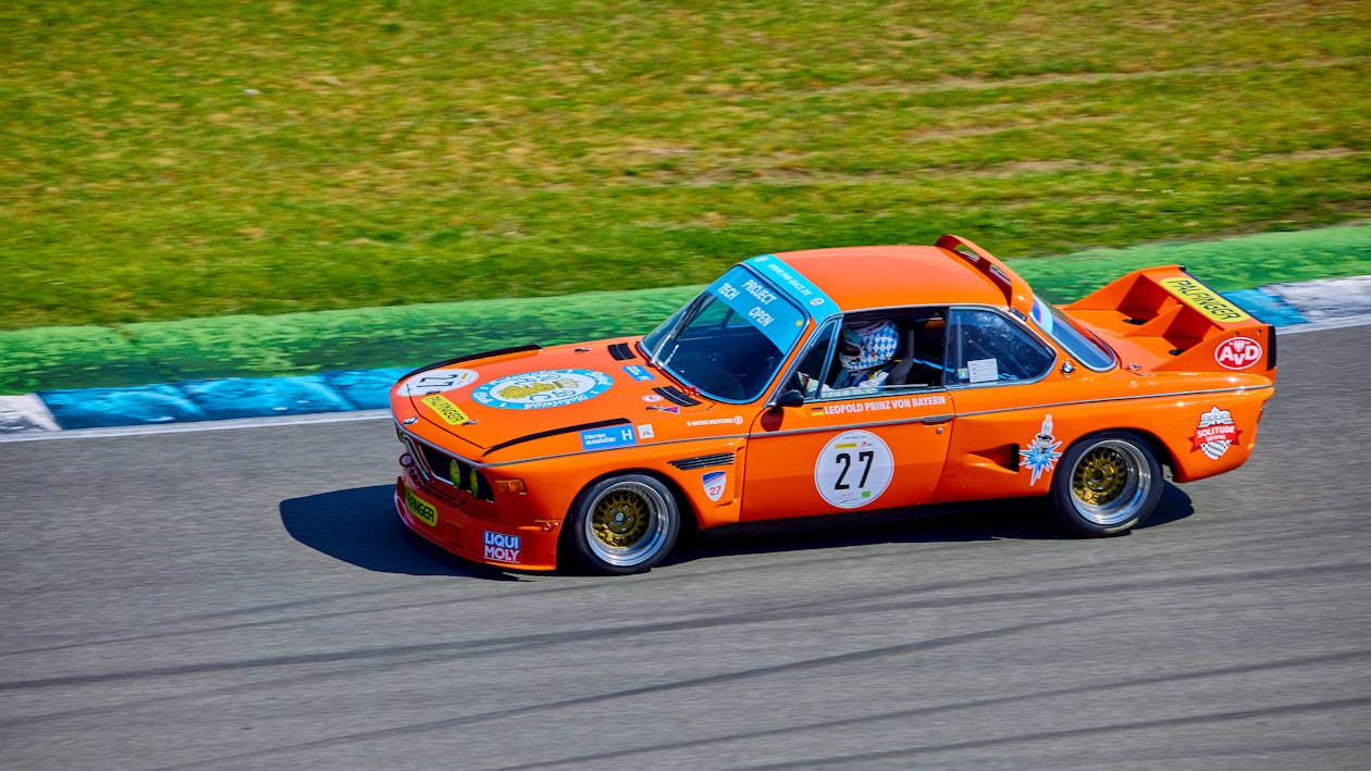 Orange Racing Car on Track