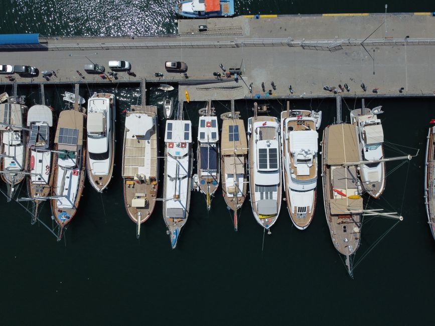 Unbeatable Full-day Pamukkale and Hierapolis Tour from Selcuk or Kusadasi Review 2026 - Drone shot capturing yachts docked at a marina in Turkey, showcasing a vibrant waterfront scene.