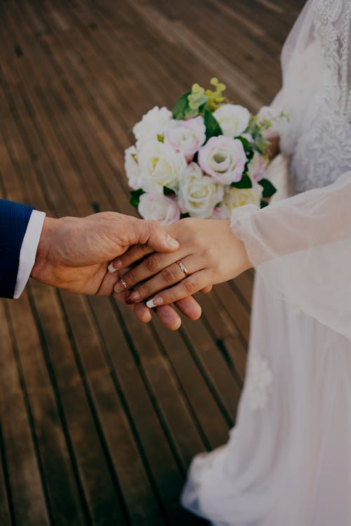 Bride and Groom Holding Hands 