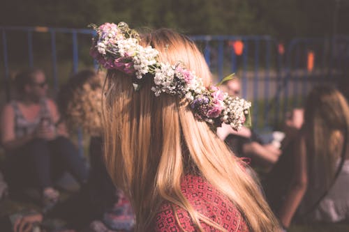 Women's Green and White Floral Headband during Nighttime