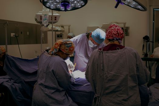 Doctor and Nurses Performs Caesarean Section in Hospital