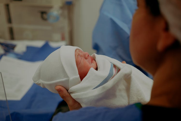 New Born Baby Wrapped With Cloth