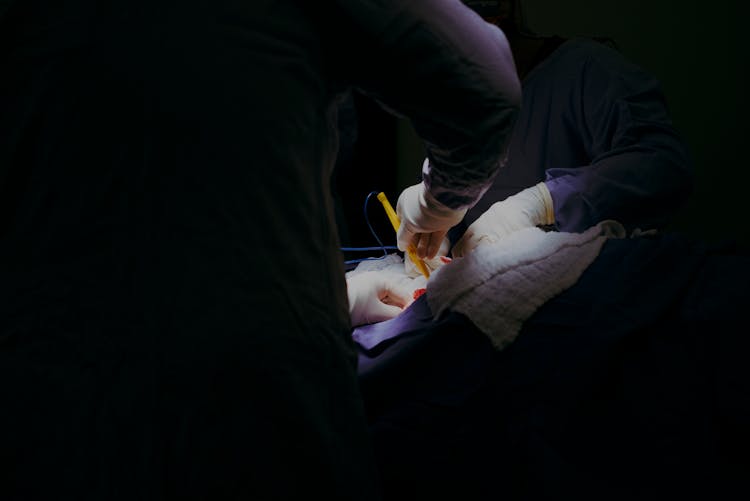 Close Up Of Doctors Hands During Surgery