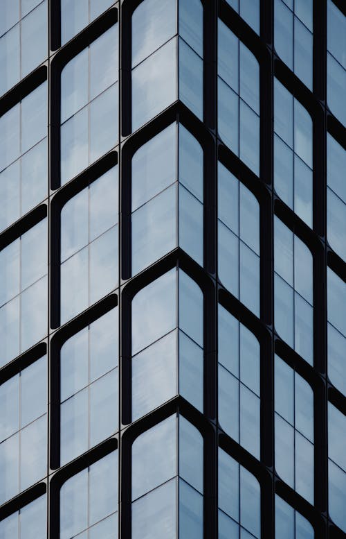 Gratis stockfoto met architectonisch, gebouw, glazen panelen