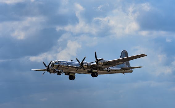 Historic B-29 Superfortress aircraft flying over San Antonio, Texas, with clear blue skies.