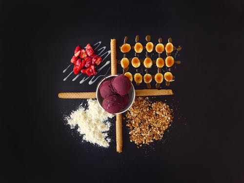 Top View of Ice Cream Scoops and Strawberries with Nuts 