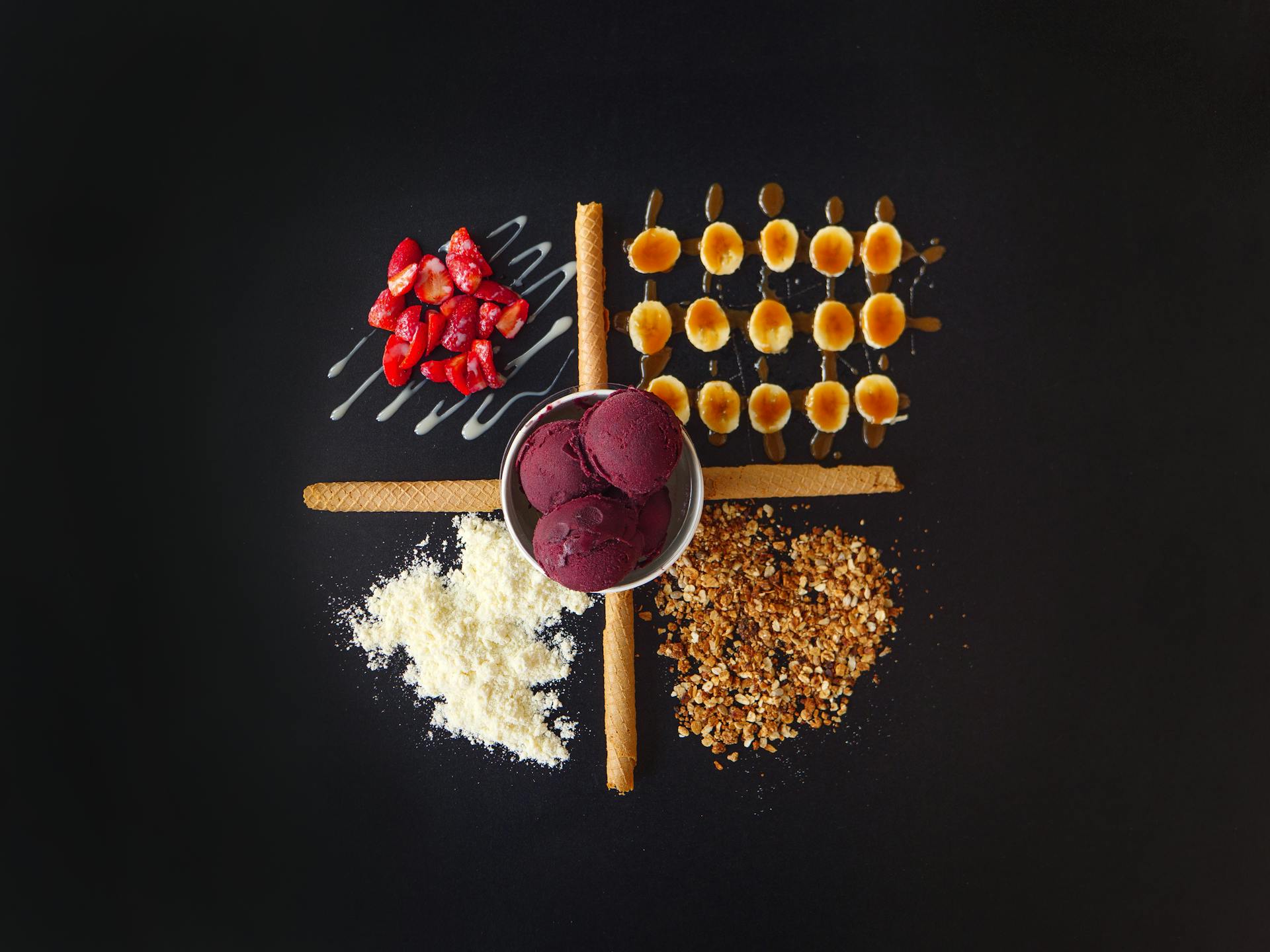 Top View of Ice Cream Scoops and Strawberries with Nuts