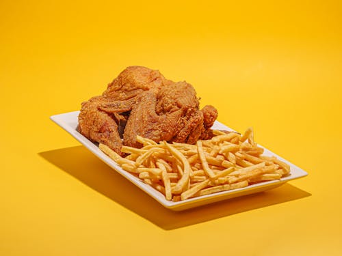 A Plate of Fried Chicken and French Fries 