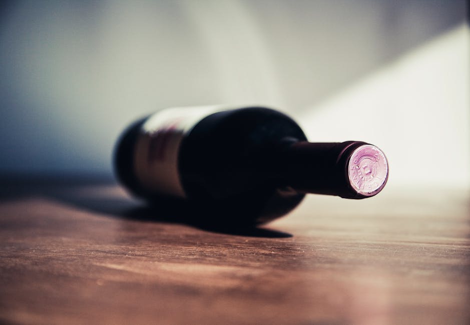 White Labeled Bottle on Brown Wooden Surface