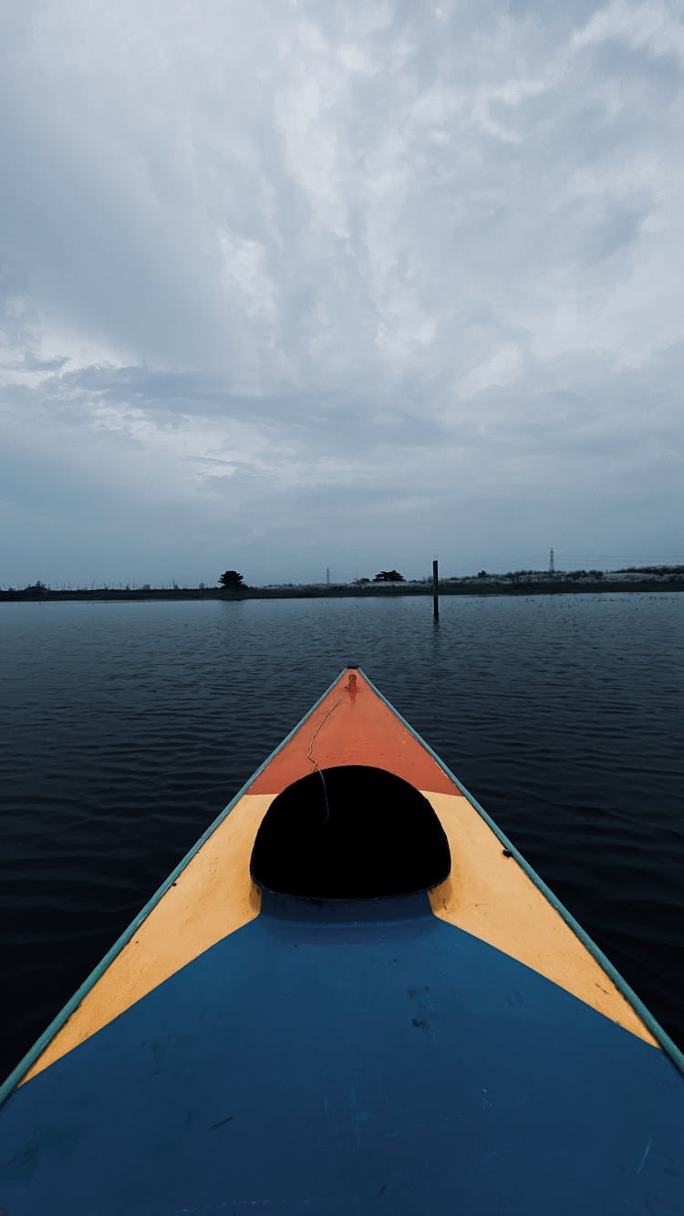 Yellow Kayak On Body Of Water