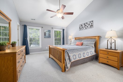 A beautifully arranged bedroom featuring a large bed and wooden furniture, ideal for comfort and style.
