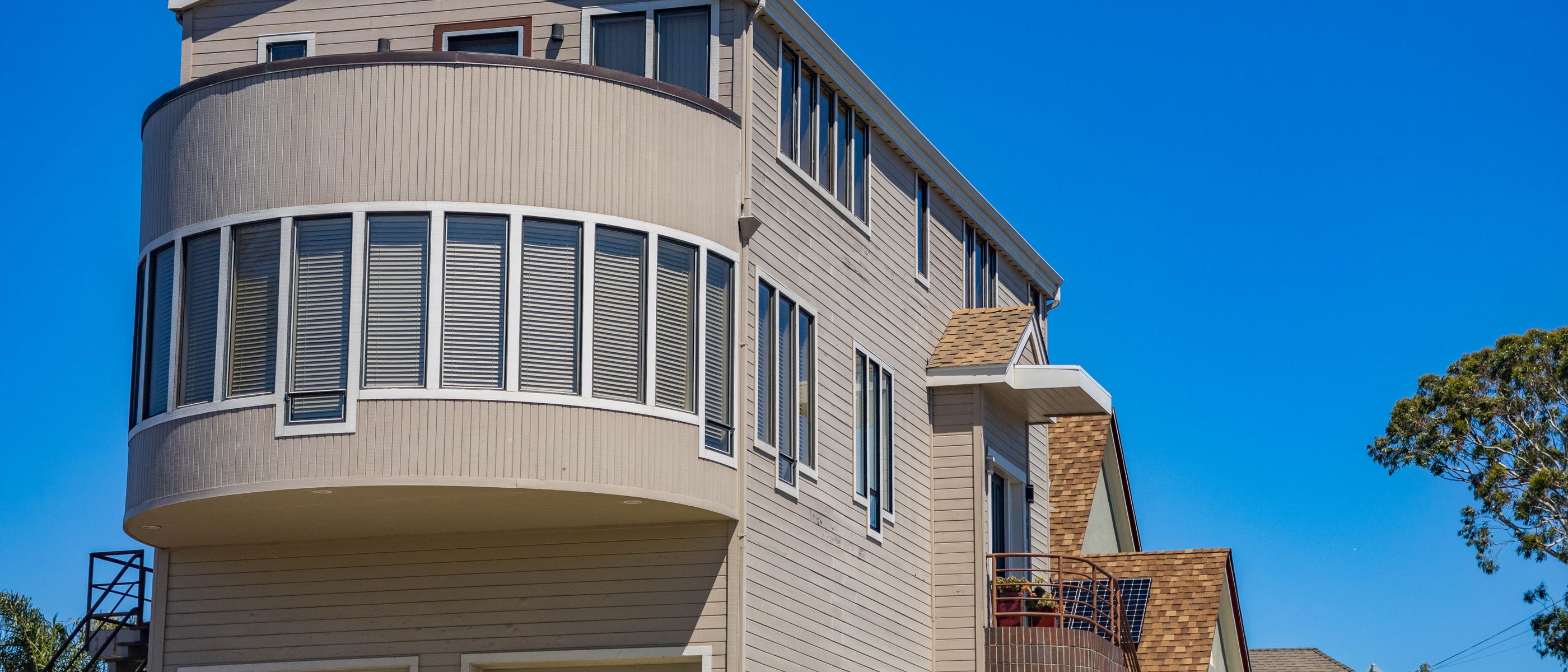 Exterior Painting in West Green — walls rolled to an even, flat finish