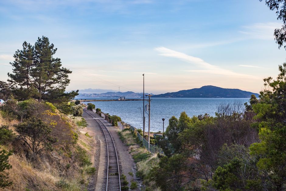 An Amtrak train traveling through a scenic landscape in the USA.