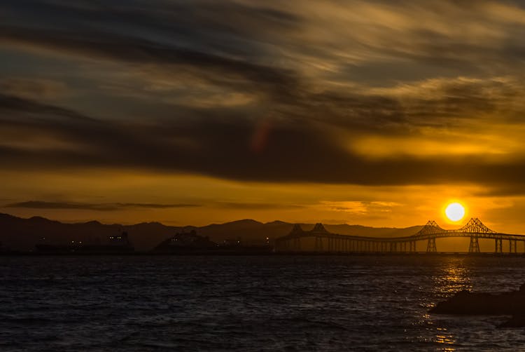 Silhouetted Richmond–San Rafael Bridge At Sunset 