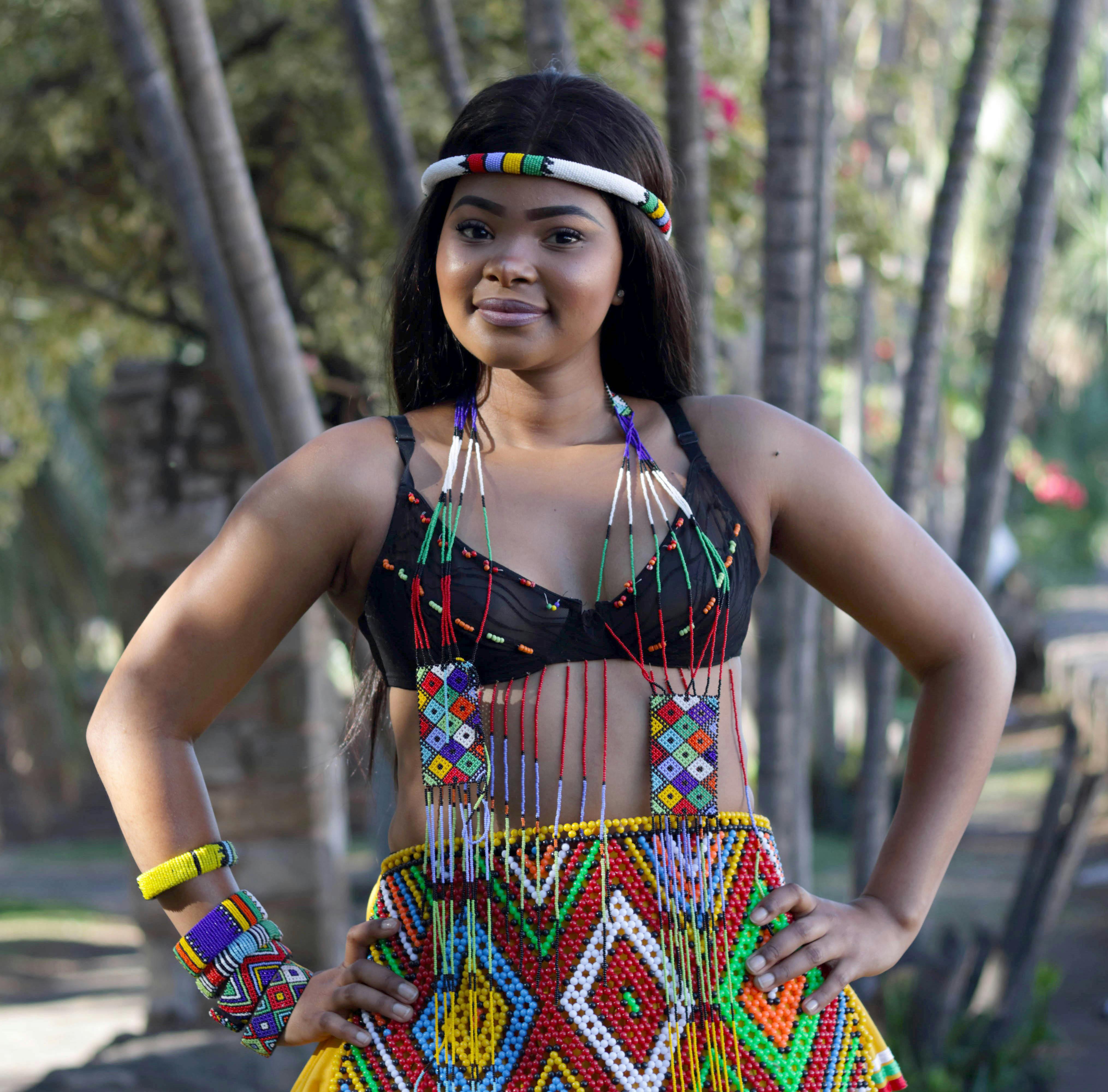 woman wearing beaded dress looking at camera