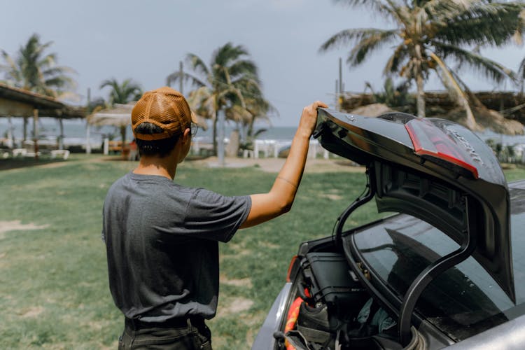 Man Holding Car Trunk