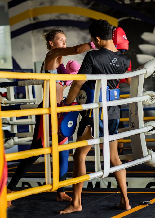 Free Two athletes practicing Muay Thai techniques in an indoor gym in Thailand. Focus on skill and intensity. Stock Photo