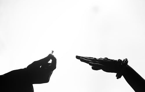 Black and White Photo of Putting a Ring on a Woman