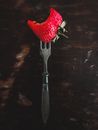 Steel Fork in a Strawberry