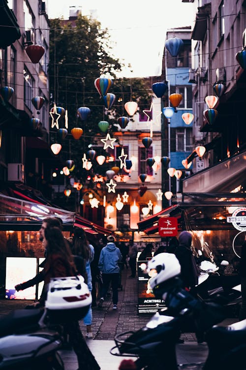 Crowd of People at an Alley With Stalls 