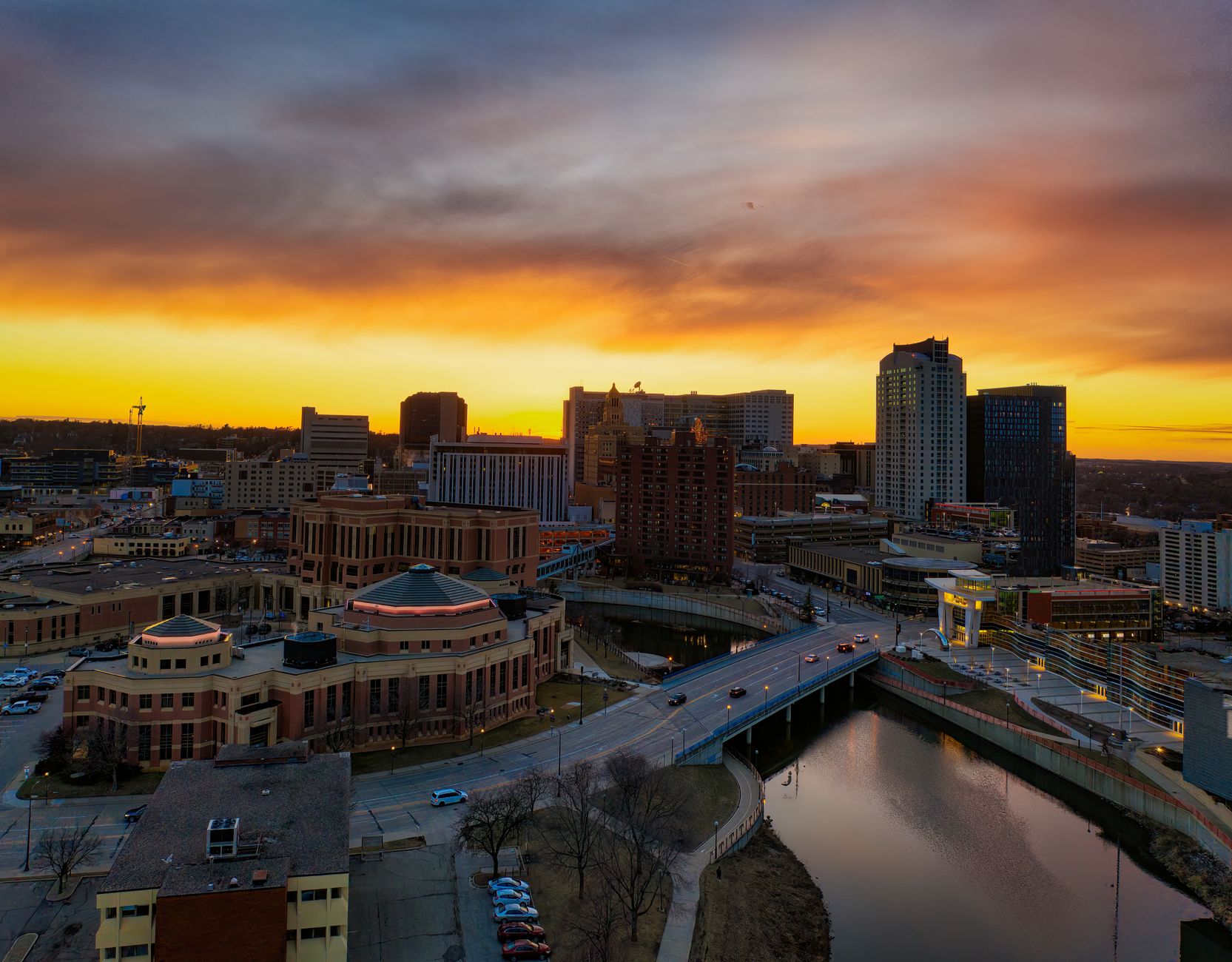 A beautiful aerial view of Rochester, MN skyline during sunset with vibrant colors.