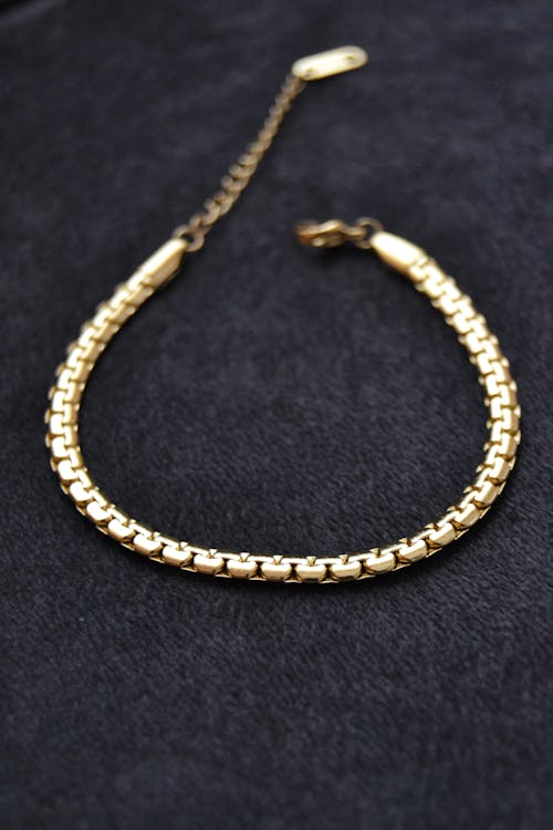 A Close-Up Shot of a Gold Bracelet