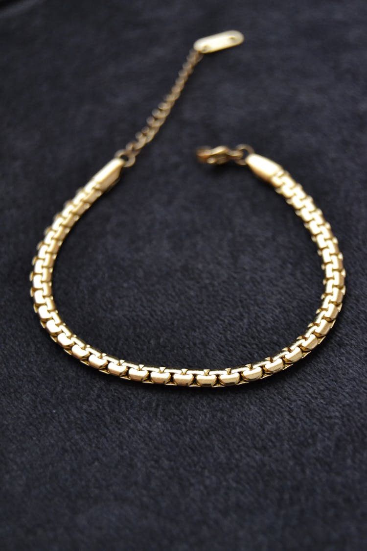 A Close-Up Shot Of A Gold Bracelet