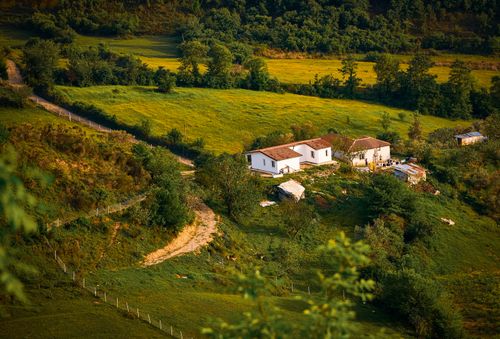 Free Aerial view of a serene countryside home in Tirana, Albania. Perfect for peaceful retreats. Stock Photo