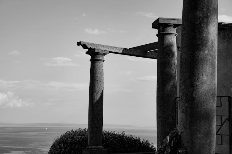 Columns Of Ancient Ruins Overlooking Landscape