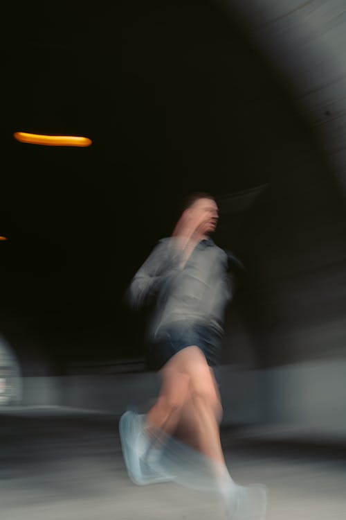 A Blurry Shot of a Man Running
